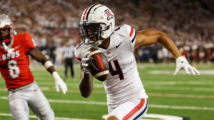 Aug 31, 2024; Tucson, Arizona, USA; New Mexico Lobos safety Christian Ellis (8) chases after Arizona Wildcats wide receiver Tetairoa McMillan (4) as he runs for the touchdown during first quarter at Arizona Stadium. Mandatory Credit: Aryanna Frank-Imagn Images