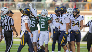 Sep 6, 2025; Athens, Ohio, USA; Ohio Bobcats safety DJ Walker (2) celebrates a defensive stop during the third quarter against the West Virginia Mountaineers at Peden Stadium. Mandatory Credit: Ben Queen-Imagn Images