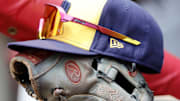 Jul 16, 2023; Cincinnati, Ohio, USA; The hat and glove of Milwaukee Brewers shortstop Willy Adames (27) sits in the dugout during a game against the Cincinnati Reds at Great American Ball Park. Mandatory Credit: David Kohl-Imagn Images