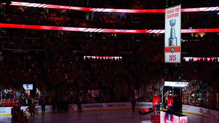 Oct 7, 2025; Sunrise, Florida, USA; Florida Panthers players watch as the team raises its second Stanley Cup banner before the game against the Chicago Blackhawks at Amerant Bank Arena. Mandatory Credit: Sam Navarro-Imagn Images