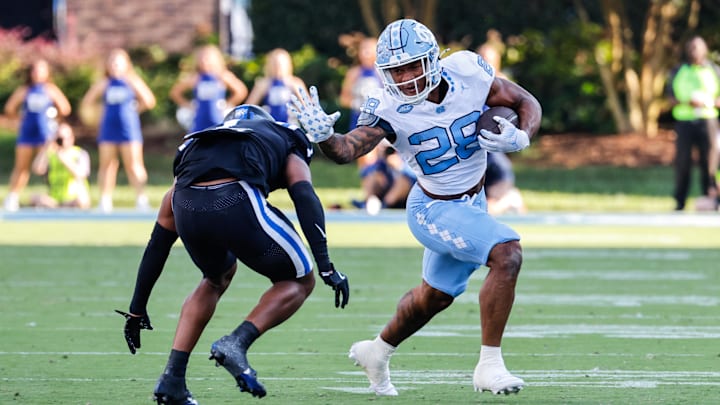 Sep 28, 2024; Durham, North Carolina, USA; North Carolina Tar Heels running back Omarion Hampton (28) runs with the ball during the first half of the game against Duke Blue Devils at Wallace Wade Stadium. Mandatory Credit: Jaylynn Nash-Imagn Images Sep 28, 2024; Durham, North Carolina, USA; North Carolina Tar Heels running back Omarion Hampton (28) runs with the ball during the first half of the game against Duke Blue Devils at Wallace Wade Stadium. Mandatory Credit: Jaylynn Nash-Imagn Images