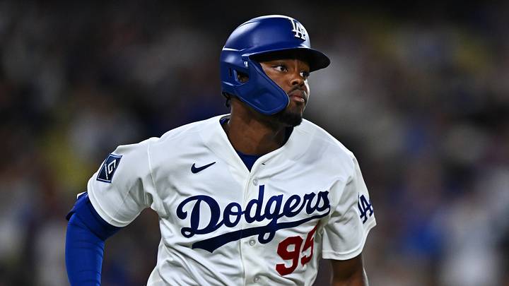 Sep 22, 2026; Los Angeles, California, USA;  Los Angeles Dodgers designated hitter Josue De Paula (95) triples during the sixth inning against the San Diego Padres at Dodger Stadium.  Mandatory Credit: William Liang-Imagn Images