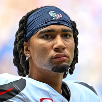 Sep 8, 2024; Indianapolis, Indiana, USA; Houston Texans quarterback C.J. Stroud (7) stands on the sidelines before the game against the Indianapolis Colts at Lucas Oil Stadium. Mandatory Credit: Marc Lebryk-Imagn Images