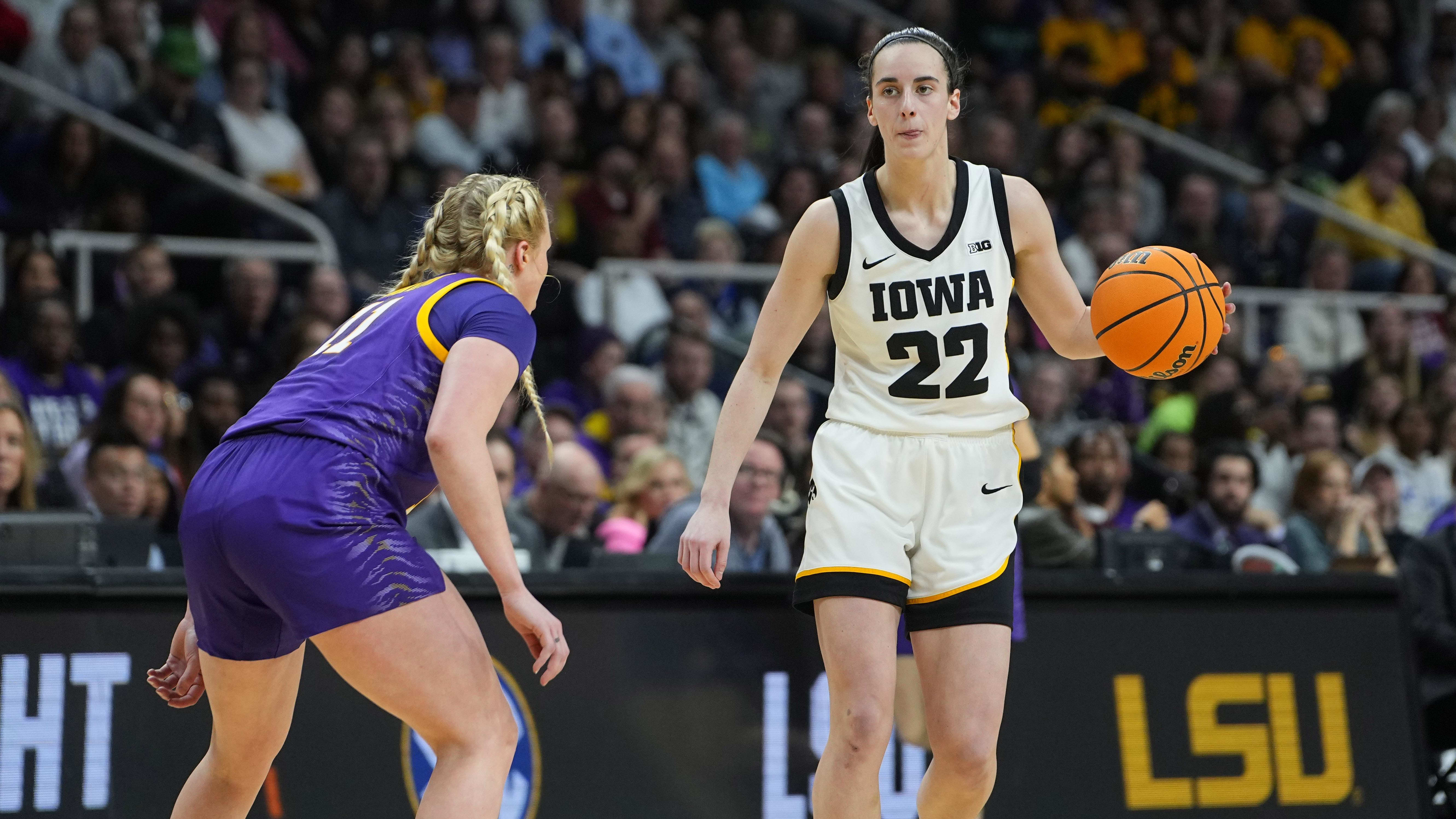 Caitlin Clark dribbles the ball against LSU.