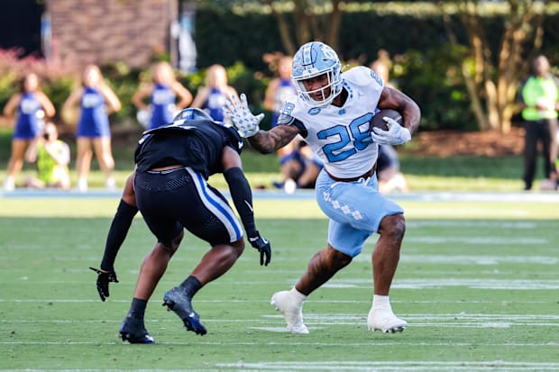   North Carolina Tar Heels running back Omarion Hampton  runs with the ball during the first half 