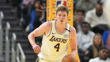 Dec 25, 2024; San Francisco, California, USA; Los Angeles Lakers guard Dalton Knecht (4) dribbles against the Golden State Warriors during the second quarter at Chase Center. Mandatory Credit: Darren Yamashita-Imagn Images