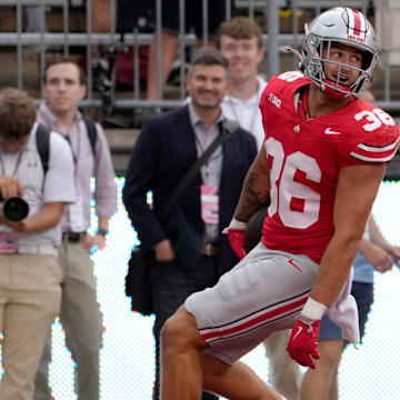 August 31, 2024; Columbus, Ohio, USA;
Ohio State Buckeyes linebacker Gabe Powers (36) runs back an interception for a touchdown during the second half of Saturday’s NCAA Division I football game against the Akron Zips at Ohio Stadium.