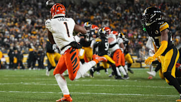 Bengals Ja'Marr Chase (1) catches a pass for a touchdown during their game against the Steelers at Acrisure Stadium on Saturday January 4, 2025. The Bengals lead the game at halftime with a score of 13-7.
