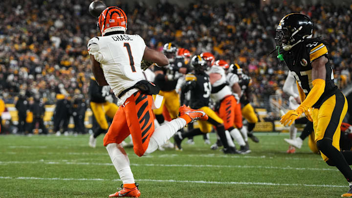 Bengals Ja'Marr Chase (1) catches a pass for a touchdown during their game against the Steelers at Acrisure Stadium on Saturday January 4, 2025. The Bengals lead the game at halftime with a score of 13-7.