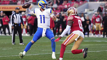 Jan 7, 2024; Santa Clara, California, USA; Los Angeles Rams quarterback Carson Wentz (11) throws a pass against San Francisco 49ers cornerback Samuel Womack III (0) for a two-point conversion during the fourth quarter at Levi's Stadium. Mandatory Credit: Darren Yamashita-Imagn Images