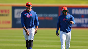 Feb 17, 2025; Port St. Lucie, FL, USA; New York Mets right fielder Juan Soto (22) talks to shortstop Luisangel Acuna (2) during a spring training workout at Clover Park. Mandatory Credit: Sam Navarro-Imagn Images