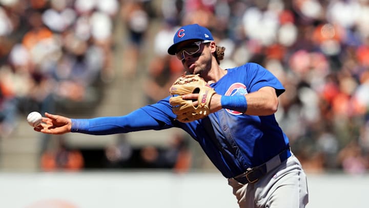 Jun 27, 2024; San Francisco, California, USA; Chicago Cubs second baseman Nico Hoerner (2) throws the ball to first base during the eighth inning against the San Francisco Giants at Oracle Park. Mandatory Credit: Darren Yamashita-Imagn Images