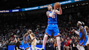 Oct 25, 2025; Atlanta, Georgia, USA; Oklahoma City Thunder center Isaiah Hartenstein (55) grabs a rebound against the Atlanta Hawks during the first half at State Farm Arena. Mandatory Credit: Dale Zanine-Imagn Images