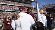 Texas A&M Aggies quarterback Marcel Reed embraces head coach Mike Elko after the game against the South Carolina Gamecocks at Kyle Field.