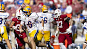 Nov 1, 2025; Stanford, California, USA; Pittsburgh Panthers quarterback Mason Heintschel (6) runs the ball against the Stanford Cardinal during the third quarter at Stanford Stadium. Mandatory Credit: John Hefti-Imagn Images