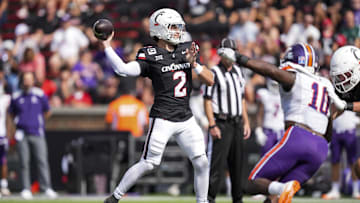 Sep 13, 2025; Cincinnati, Ohio, USA;  Cincinnati Bearcats quarterback Brendan Sorsby (2) throws a pass for a touchdown against the Northwestern State Demons in the first half at Nippert Stadium. Mandatory Credit: Aaron Doster-Imagn Images