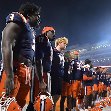 Aug 29, 2024; Champaign, Illinois, USA;  The Illinois Fighting Illini team salute their fans at the final of Thursday’s 45-0 game over Eastern Illinois Panthers at  Memorial Stadium. Mandatory Credit: Ron Johnson-USA TODAY Sports