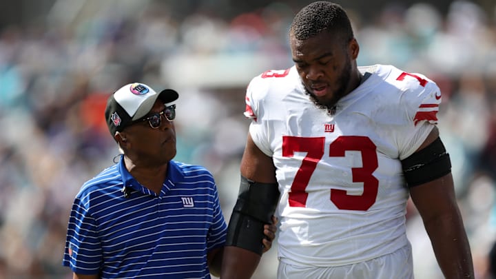 Oct 23, 2022; Jacksonville, Florida, USA;  New York Giants offensive tackle Evan Neal (73) leaves the field with an injury against the Jacksonville Jaguars in the second quarter at TIAA Bank Field. Mandatory Credit: Nathan Ray Seebeck-Imagn Images