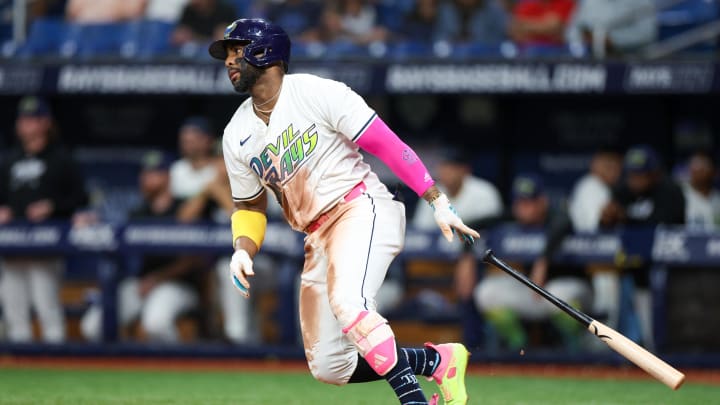 Jul 12, 2024; St. Petersburg, Florida, USA; Tampa Bay Rays first baseman Yandy Diaz (2) singles against the Cleveland Guardians in the seventh inning at Tropicana Field. Mandatory Credit: Nathan Ray Seebeck-USA TODAY Sports