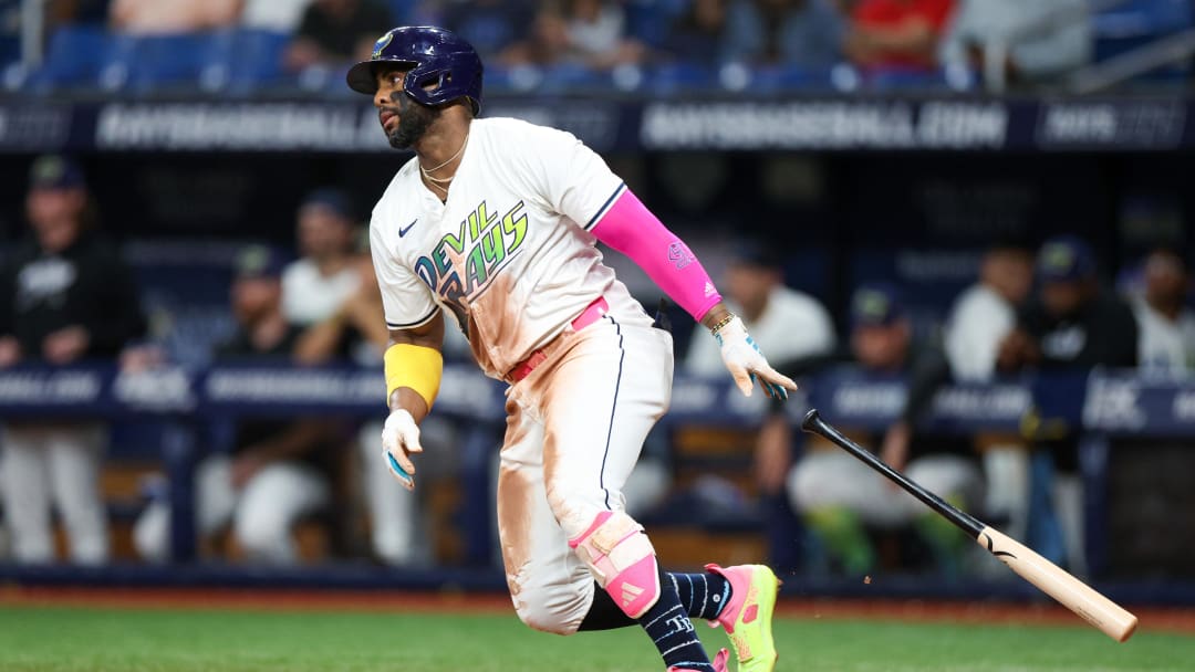 Jul 12, 2024; St. Petersburg, Florida, USA; Tampa Bay Rays first baseman Yandy Diaz (2) singles against the Cleveland Guardians in the seventh inning at Tropicana Field. 