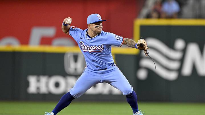 Sep 21, 2025; Arlington, Texas, USA; Texas Rangers second baseman Cody Freeman (39) throws to first base as he turns a double play against the Miami Marlins during the sixth inning at Globe Life Field. Mandatory Credit: Jerome Miron-Imagn Images