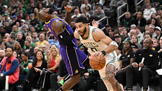 Mar 8, 2025; Boston, Massachusetts, USA; Los Angeles Lakers forward LeBron James (23) reacts after being fouled by Boston Celtics forward Jayson Tatum (0) during the fourth quarter at the TD Garden. Mandatory Credit: Brian Fluharty-Imagn Images