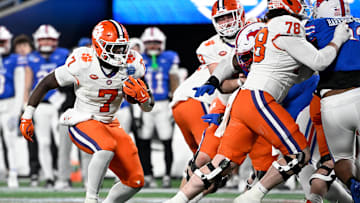 Clemson Tigers running back Phil Mafah runs during the third quarter against the Southern Methodist Mustangs in the 2024 ACC Championship game at Bank of America Stadium. 