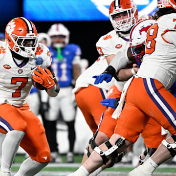 Clemson Tigers running back Phil Mafah runs during the third quarter against the Southern Methodist Mustangs in the 2024 ACC Championship game at Bank of America Stadium. 