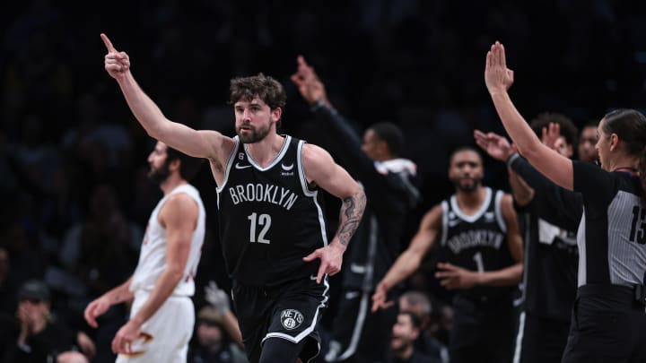 Mar 21, 2023; Brooklyn, New York, USA; Brooklyn Nets forward Joe Harris (12) reacts after a three-point basket against the Cleveland Cavaliers during the first half at Barclays Center. Mandatory Credit: Vincent Carchietta-USA TODAY Sports