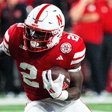 Sep 7, 2024; Lincoln, Nebraska, USA; Nebraska Cornhuskers running back Emmett Johnson (21) runs against the Colorado Buffaloes during the fourth quarter at Memorial Stadium. 