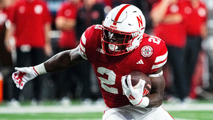 Sep 7, 2024; Lincoln, Nebraska, USA; Nebraska Cornhuskers running back Emmett Johnson (21) runs against the Colorado Buffaloes during the fourth quarter at Memorial Stadium. 