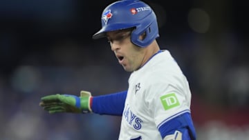 Nov 1, 2025; Toronto, Ontario, CAN; Toronto Blue Jays right fielder George Springer (4) reacts after hitting a single against the Los Angeles Dodgers in the first inning during game seven of the 2025 MLB World Series at Rogers Centre. 