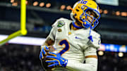 Pittsburgh Panthers wide receiver Kenny Johnson (2) celebrates his touchdown during one of the six overimes during of the 2024 GameAbove Sports Bowl at Ford Field in Detroit, on Thursday, Dec. 26, 2024.