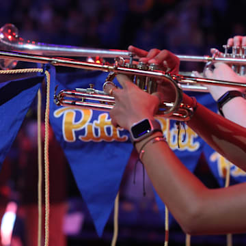 Jan 18, 2025; Pittsburgh, Pennsylvania, USA; The University of Pittsburgh Panthers band herald trumpets play the national anthem before the game against the Clemson Tigers at the Petersen Events Center. Mandatory Credit: Charles LeClaire-Imagn Images