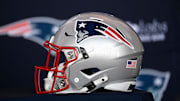 Jan 17, 2024; Foxborough, MA, USA; A New England Patriots helmet sits on a table prior to a press conference at Gillette Stadium. Mandatory Credit: Eric Canha-Imagn Images