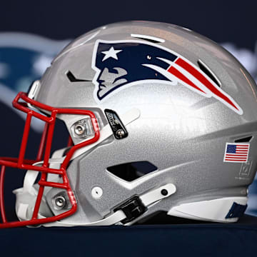 Jan 17, 2024; Foxborough, MA, USA; A New England Patriots helmet sits on a table prior to a press conference at Gillette Stadium. Mandatory Credit: Eric Canha-Imagn Images