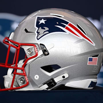 Jan 17, 2024; Foxborough, MA, USA; A New England Patriots helmet sits on a table prior to a press conference at Gillette Stadium. Mandatory Credit: Eric Canha-Imagn Images