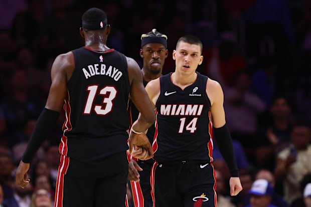 Miami Heat guard Tyler Herro (14) celebrates with Miami Heat center Bam Adebayo (13)