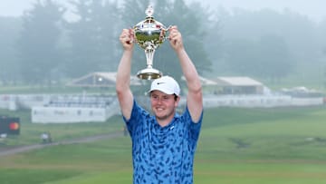 Robert MacIntyre hoists the trophy after winning the RBC Canadian Open on the PGA Tour.