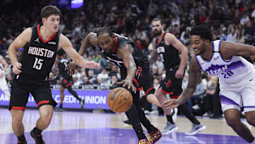Nov 30, 2025; Salt Lake City, Utah, USA; Houston Rockets forward Kevin Durant (7) reaches for the ball with guard Reed Sheppard (15) as Utah Jazz forward Brice Sensabaugh (28) defends during the second quarter at Delta Center. Mandatory Credit: Rob Gray-Imagn Images