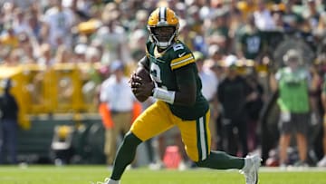 Sep 15, 2024; Green Bay, Wisconsin, USA;  Green Bay Packers quarterback Malik Willis (2) rolls out of the pocket looking to throw a pass during the second quarter against the Indianapolis Colts at Lambeau Field. Mandatory Credit: Jeff Hanisch-Imagn Images