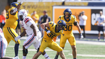 Aug 30, 2025; Morgantown, West Virginia, USA; West Virginia Mountaineers linebacker Reid Carrico (35) celebrates after a defensive stop during the second quarter against the Robert Morris Colonials at Milan Puskar Stadium. Mandatory Credit: Ben Queen-Imagn Images