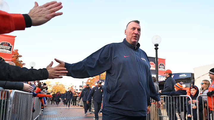 Nov 1, 2025; Champaign, Illinois, USA;  Illinois Fighting Illini head coach Bret Bielema greets fans before an NCAA game against the Rutgers Scarlet Knights at Memorial Stadium. Mandatory Credit: Ron Johnson-Imagn Images