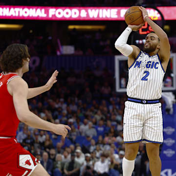Oct 25, 2025; Orlando, Florida, USA;  Orlando Magic guard Tyus Jones (2) takes a shot over Chicago Bulls guard Josh Giddey (3) in the first half at Kia Center. Mandatory Credit: Russell Lansford-Imagn Images