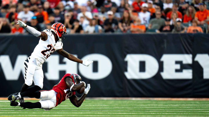 Tampa Bay Buccaneers wide receiver Rakim Jarrett (18) makes a catch as Cincinnati Bengals cornerback Dax Hill (23) defends in the second quarter of the NFL preseason game at Paycor Stadium in Cincinnati on Saturday, August 10, 2024.