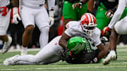 Oct 11, 2025; Eugene, Oregon, USA; Indiana Hoosiers linebacker Rolijah Hardy (21) tackles Oregon Ducks running back Jordon Davison (0) during the second quarter at Autzen Stadium. Mandatory Credit: Troy Wayrynen-Imagn Images