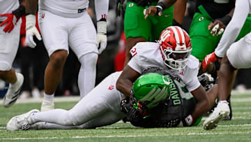 Oct 11, 2025; Eugene, Oregon, USA; Indiana Hoosiers linebacker Rolijah Hardy (21) tackles Oregon Ducks running back Jordon Davison (0) during the second quarter at Autzen Stadium. Mandatory Credit: Troy Wayrynen-Imagn Images