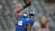 Aug 8, 2024; East Rutherford, New Jersey, USA; New York Giants wide receiver Malik Nabers (9) makes a catch during warm ups before the game against the Detroit Lions at MetLife Stadium. Mandatory Credit: Vincent Carchietta-USA TODAY Sports