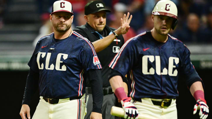 Aug 23, 2024; Cleveland, Ohio, USA; Cleveland Guardians manager Stephen Vogt, left, gets between center fielder Lane Thomas (8) and home plate umpire Adam Hamari after Thomas struck out during the eighth inning against the Texas Rangers at Progressive Field. Mandatory Credit: Ken Blaze-USA TODAY Sports