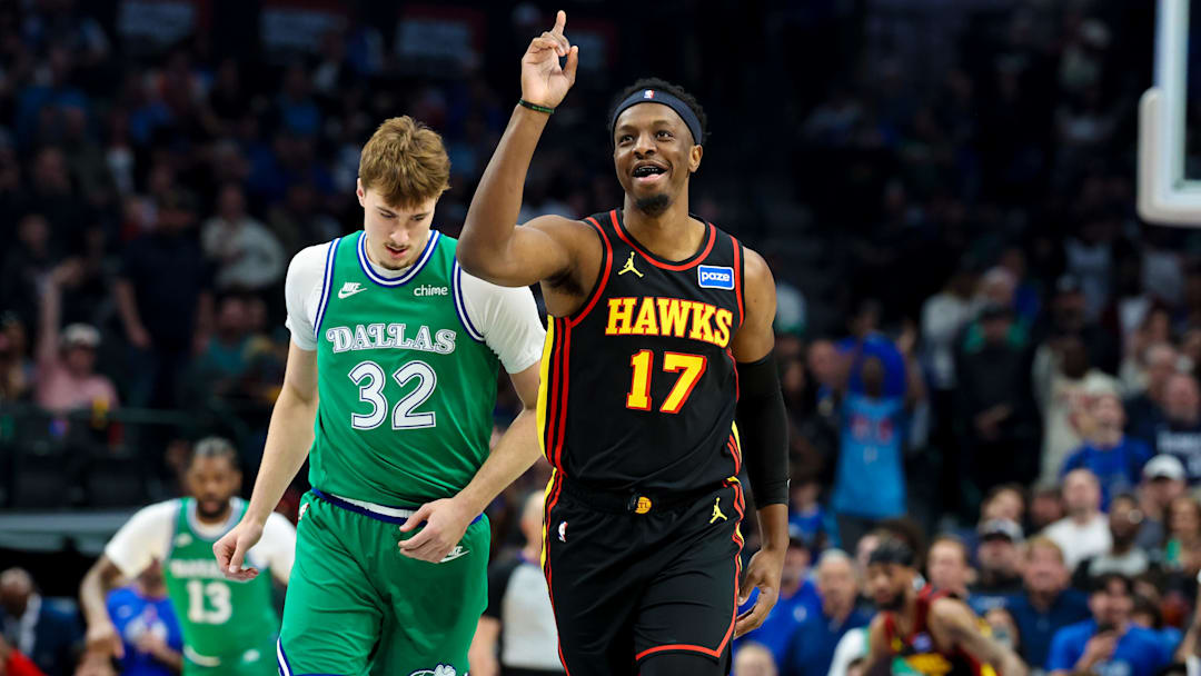 Mar 18, 2026; Dallas, Texas, USA; Atlanta Hawks forward Onyeka Okongwu (17) reacts in front of Dallas Mavericks forward Cooper Flagg (32) after scoring during the first quarter at American Airlines Center. Mandatory Credit: Kevin Jairaj-Imagn Images